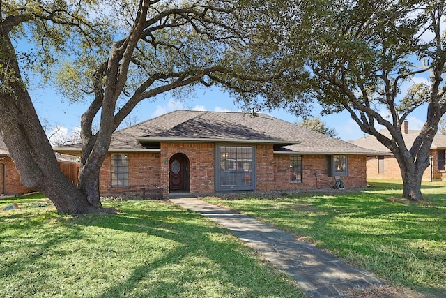 ranch-style house with a front lawn