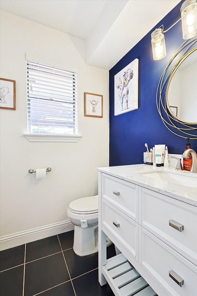 bathroom featuring vanity, toilet, and tile patterned flooring