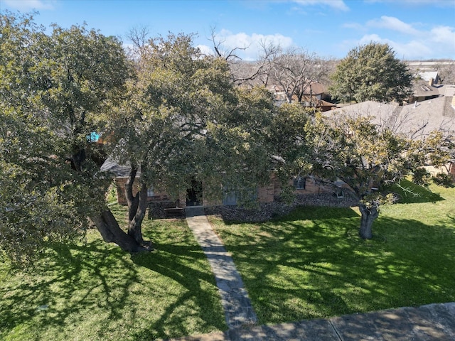 obstructed view of property featuring a front yard