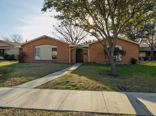 ranch-style house with a front lawn