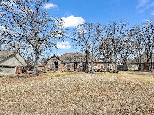 view of front facade with a garage and a front yard