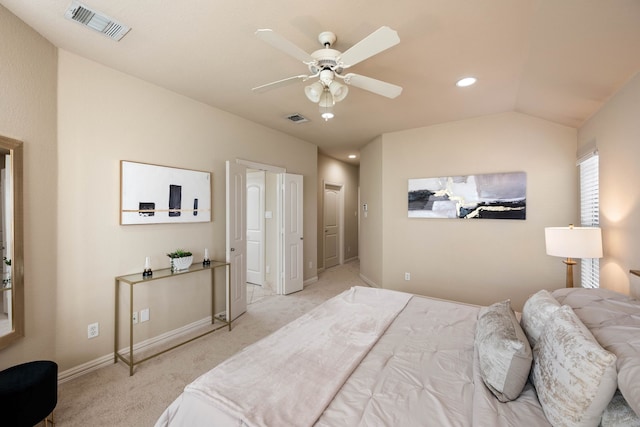 carpeted bedroom with vaulted ceiling and ceiling fan