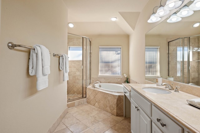 bathroom with vanity, tile patterned floors, and independent shower and bath