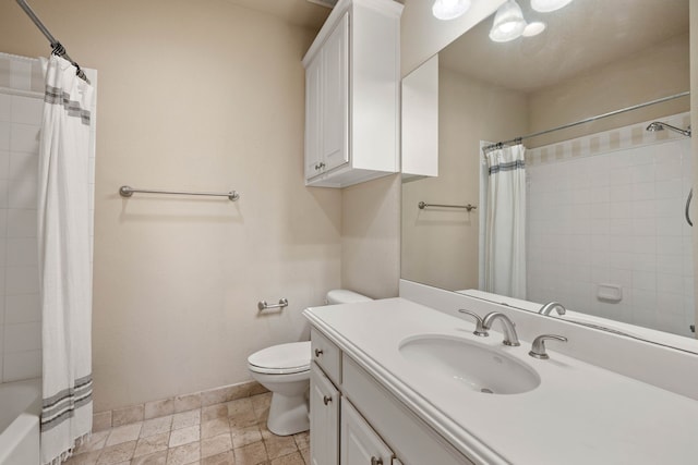 full bathroom featuring vanity, shower / bath combo with shower curtain, and toilet