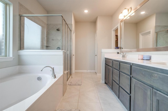 bathroom with tile patterned flooring, vanity, and separate shower and tub