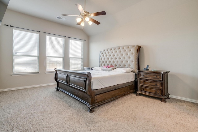 bedroom with lofted ceiling, light colored carpet, and ceiling fan