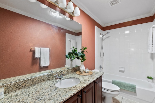 full bathroom with crown molding, tile patterned flooring, vanity, toilet, and tiled shower / bath