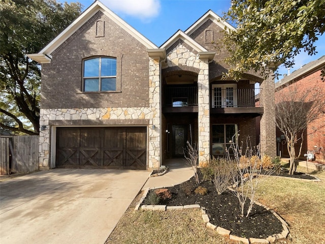 view of front of home with a garage and a balcony