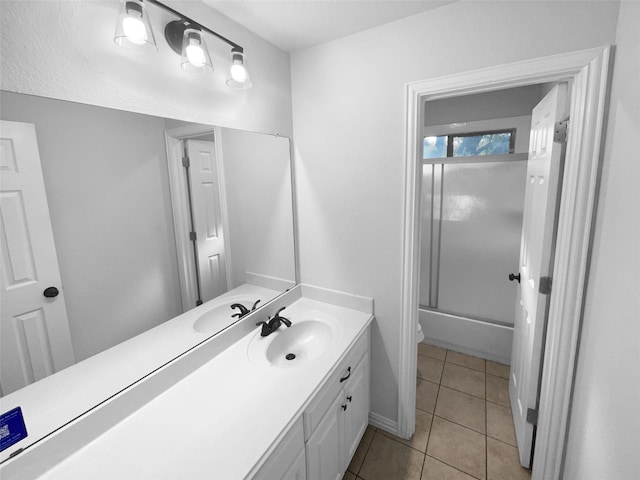 bathroom with vanity, tile patterned floors, and shower / bath combination with glass door