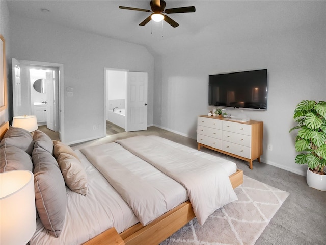 bedroom featuring ensuite bath, light colored carpet, and ceiling fan