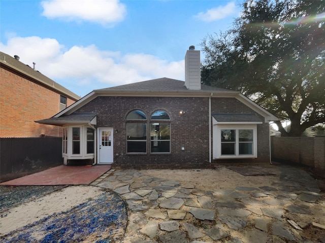 back of house with a patio area