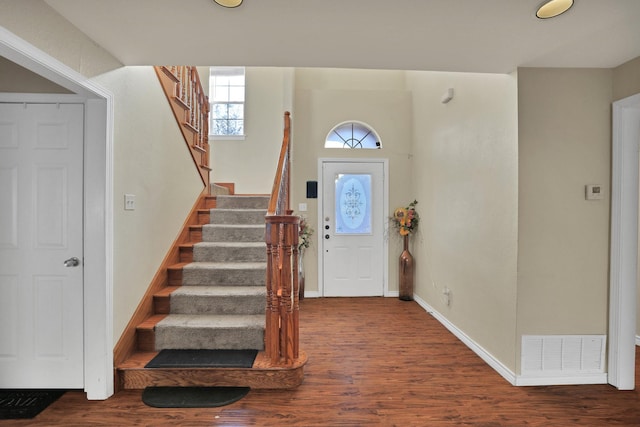 foyer entrance with hardwood / wood-style floors