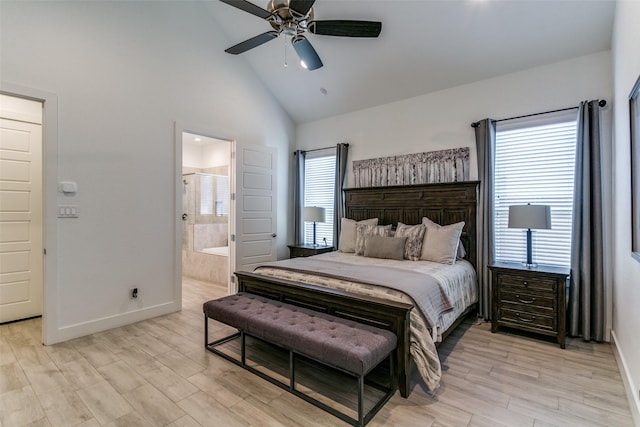 bedroom featuring high vaulted ceiling, multiple windows, and light wood-type flooring