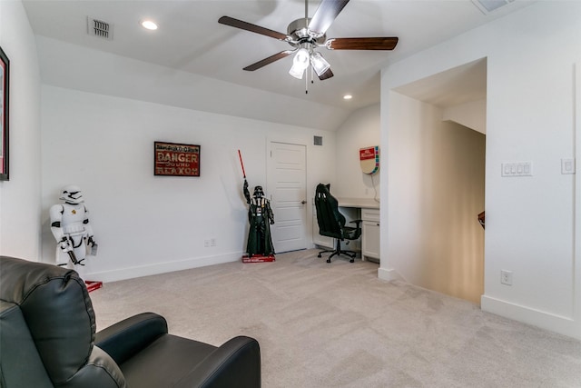 interior space with ceiling fan, lofted ceiling, and light carpet