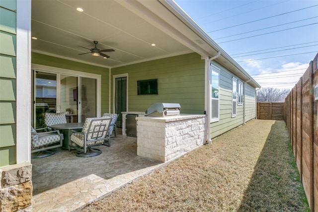 view of patio / terrace with ceiling fan and a grill