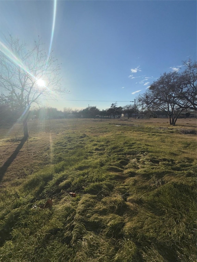 view of yard with a rural view