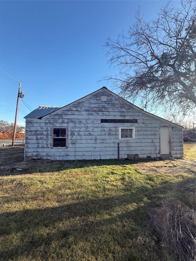 view of home's exterior featuring a yard