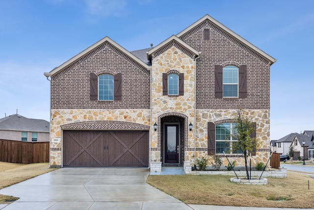 front facade featuring a garage and a front lawn