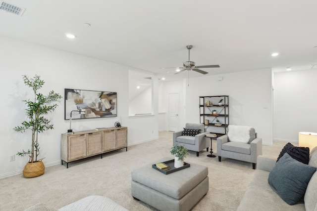 living room with light colored carpet and ceiling fan