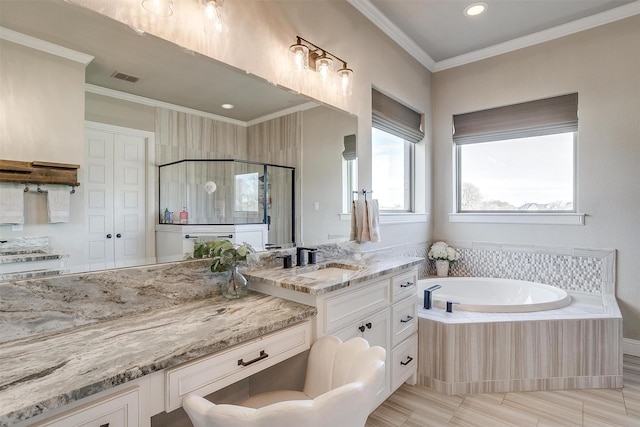 bathroom featuring independent shower and bath, vanity, tile patterned flooring, and crown molding