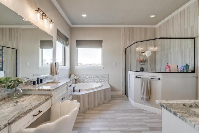 bathroom with vanity, separate shower and tub, and crown molding