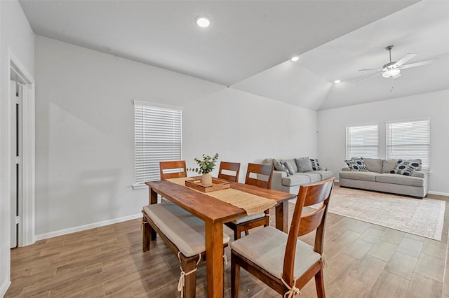 dining area with vaulted ceiling and ceiling fan