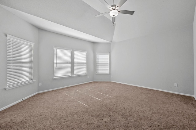 carpeted spare room featuring high vaulted ceiling and ceiling fan