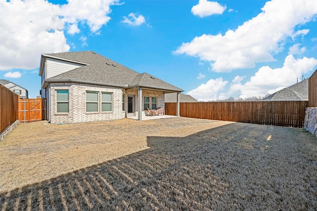 back of property featuring a patio area