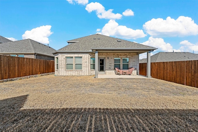 rear view of property featuring a patio