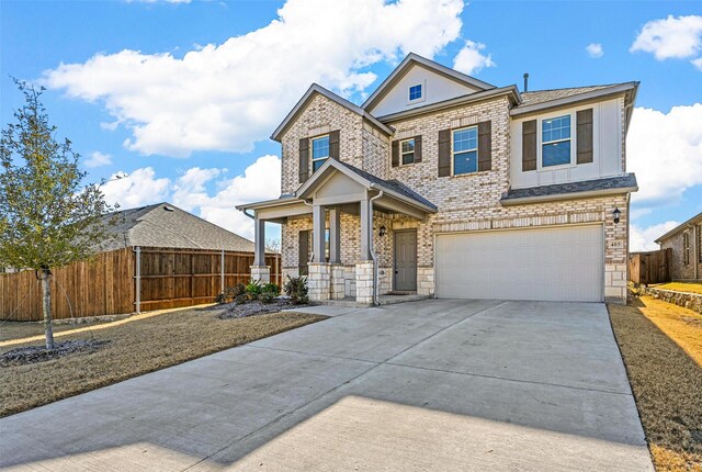 view of front of home featuring a garage and covered porch