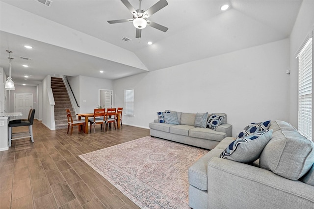 living room with lofted ceiling and ceiling fan