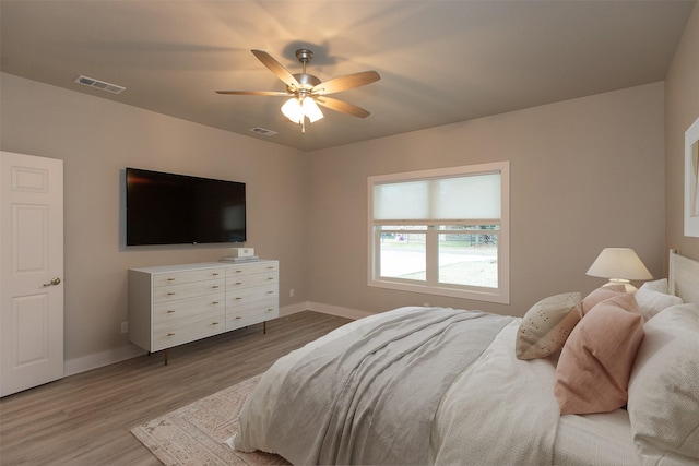 bedroom featuring ceiling fan and wood-type flooring