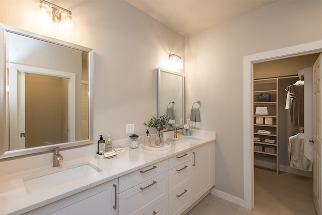 bathroom featuring vanity and wood-type flooring