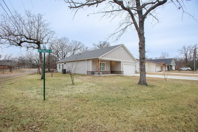 view of property exterior with a garage, a yard, and central air condition unit