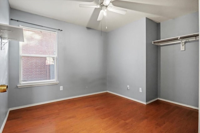 unfurnished bedroom featuring hardwood / wood-style floors and ceiling fan