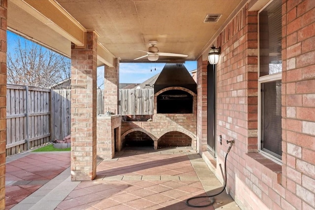 view of patio / terrace featuring ceiling fan