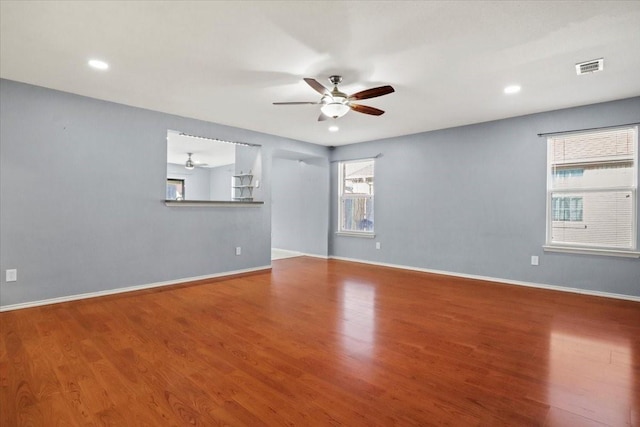 unfurnished living room featuring hardwood / wood-style flooring and ceiling fan