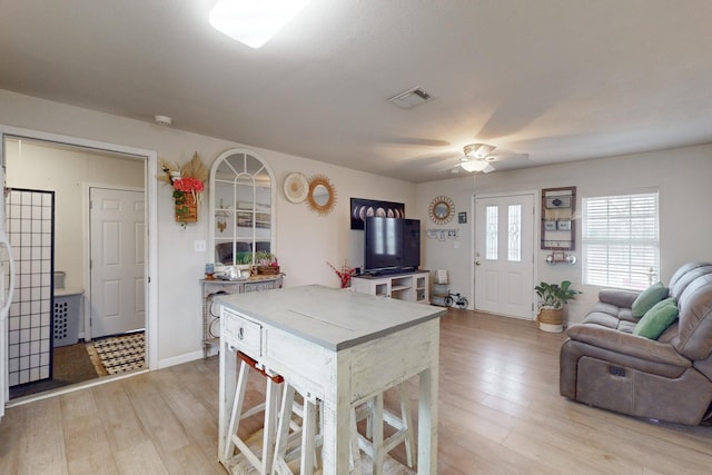 dining area featuring ceiling fan and light hardwood / wood-style flooring