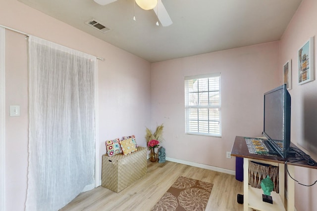 sitting room featuring light hardwood / wood-style flooring and ceiling fan