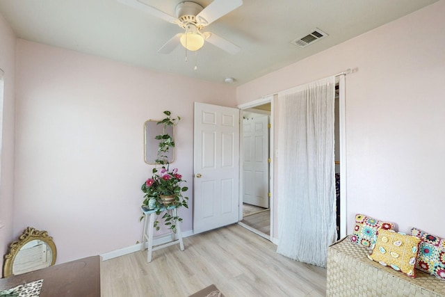 bedroom with ceiling fan and light wood-type flooring