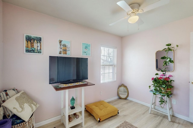 sitting room featuring ceiling fan and light hardwood / wood-style floors