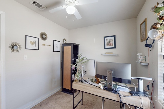 carpeted office featuring ceiling fan