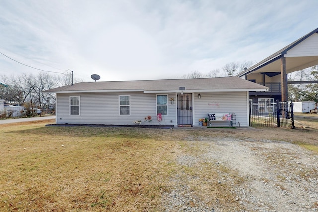 single story home featuring a front lawn