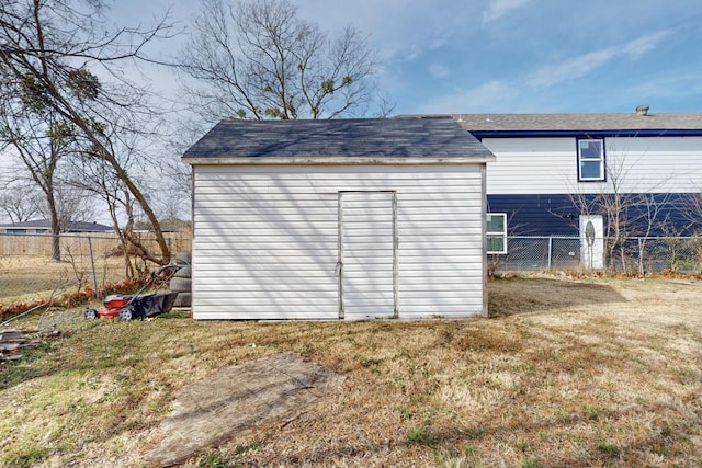 view of outbuilding featuring a yard