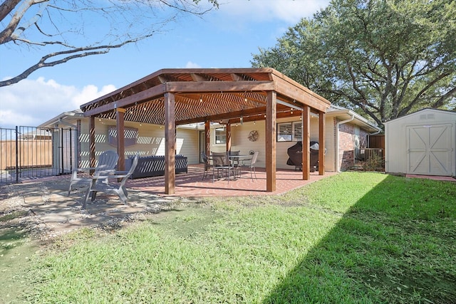 rear view of property with a storage unit, a patio, and a lawn