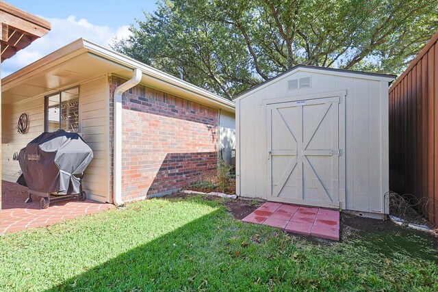 view of outbuilding with a lawn