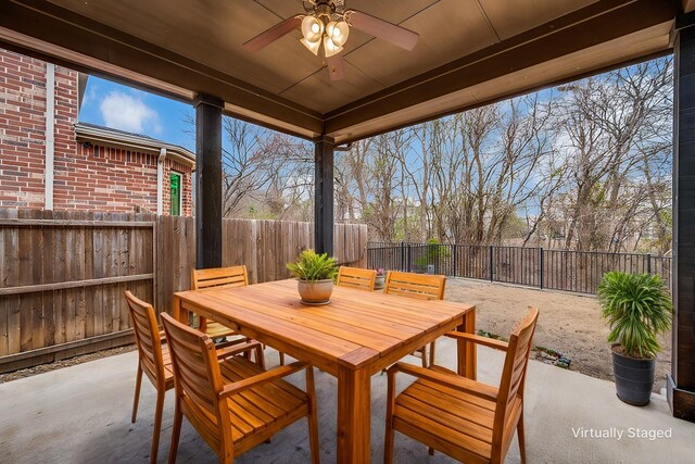 view of patio featuring ceiling fan