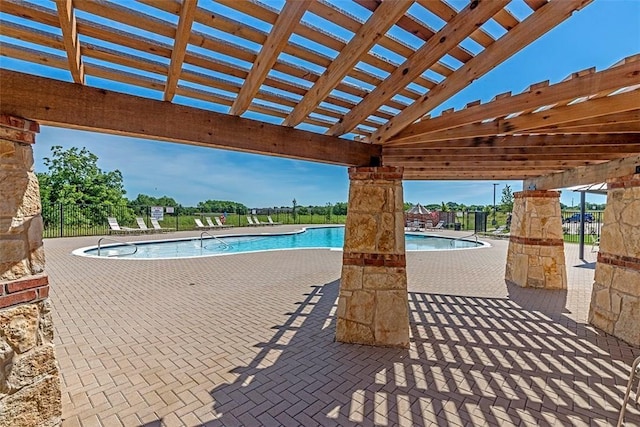 view of swimming pool with a pergola and a patio area