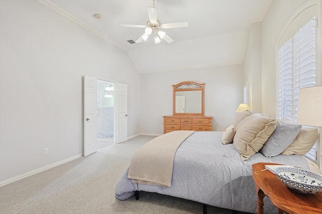 carpeted bedroom featuring ornamental molding, lofted ceiling, ceiling fan, and ensuite bath