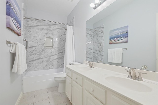 full bathroom featuring tile patterned flooring, vanity, tiled shower / bath combo, and toilet